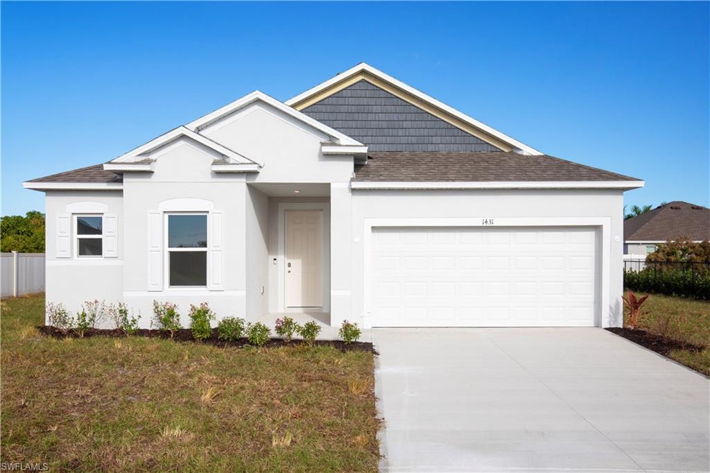 View of front of house with a shingled roof, a garage, driveway, and stucco siding