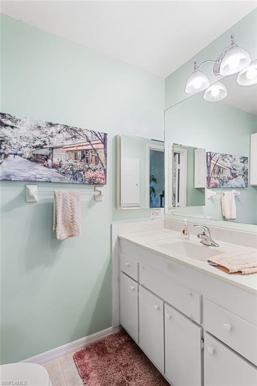 Bathroom featuring vanity and light tile patterned floors