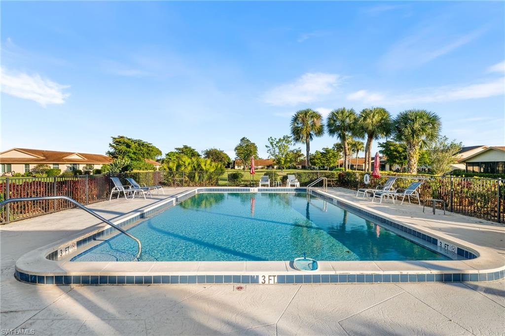 Community pool with a patio area