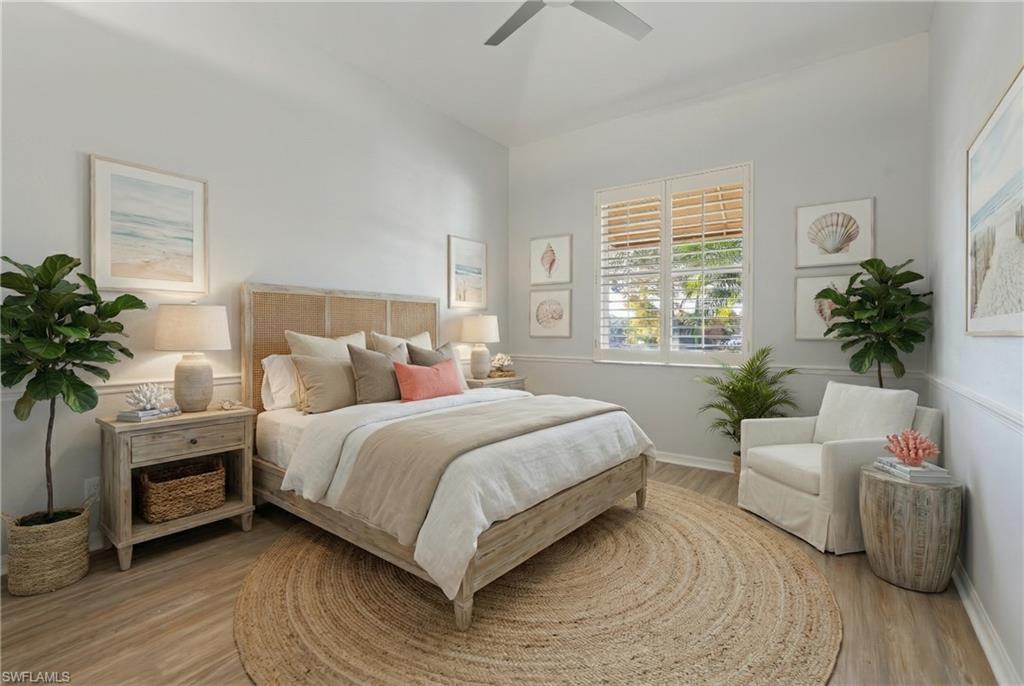 Bedroom with a ceiling fan and light wood finished floors