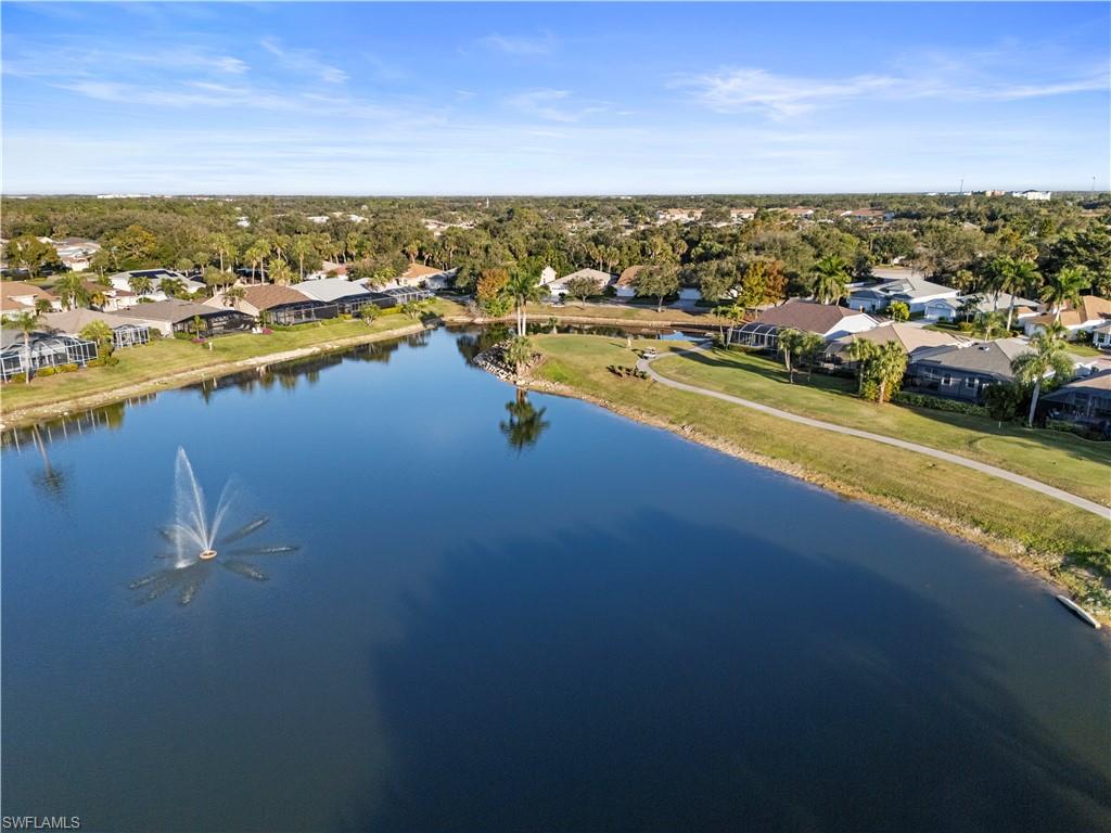 Aerial perspective of suburban area with a nearby body of water