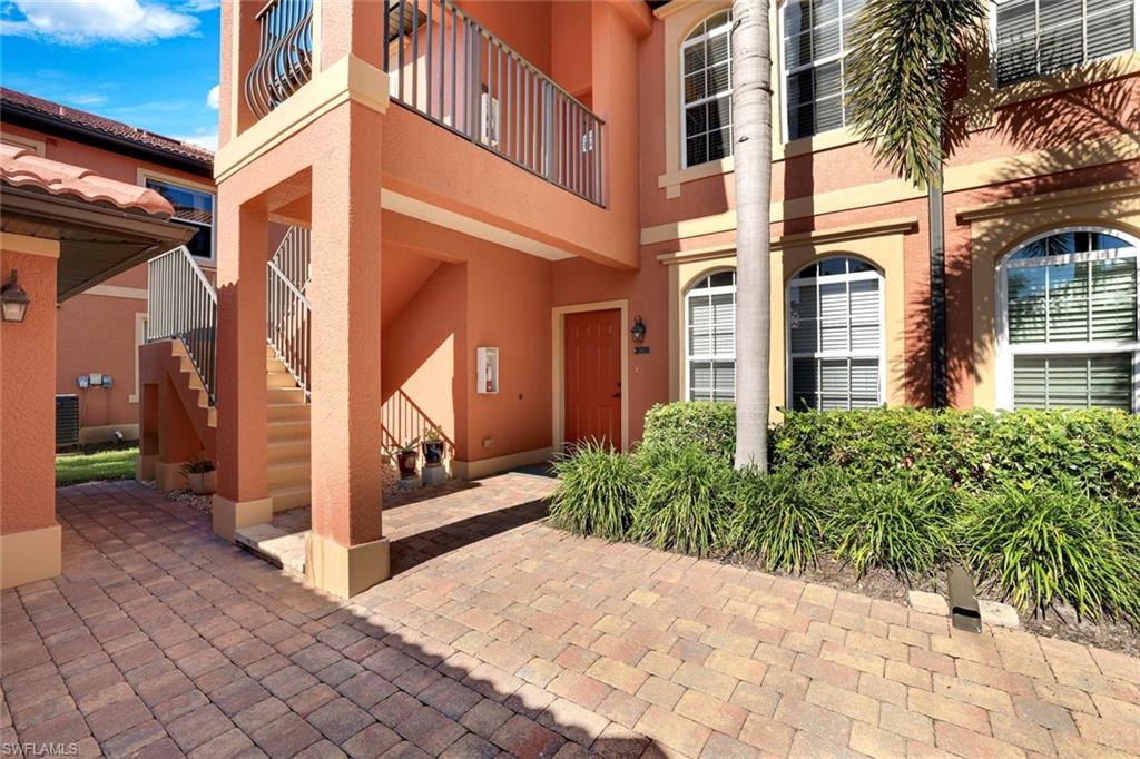 Doorway to property with a patio and stucco siding