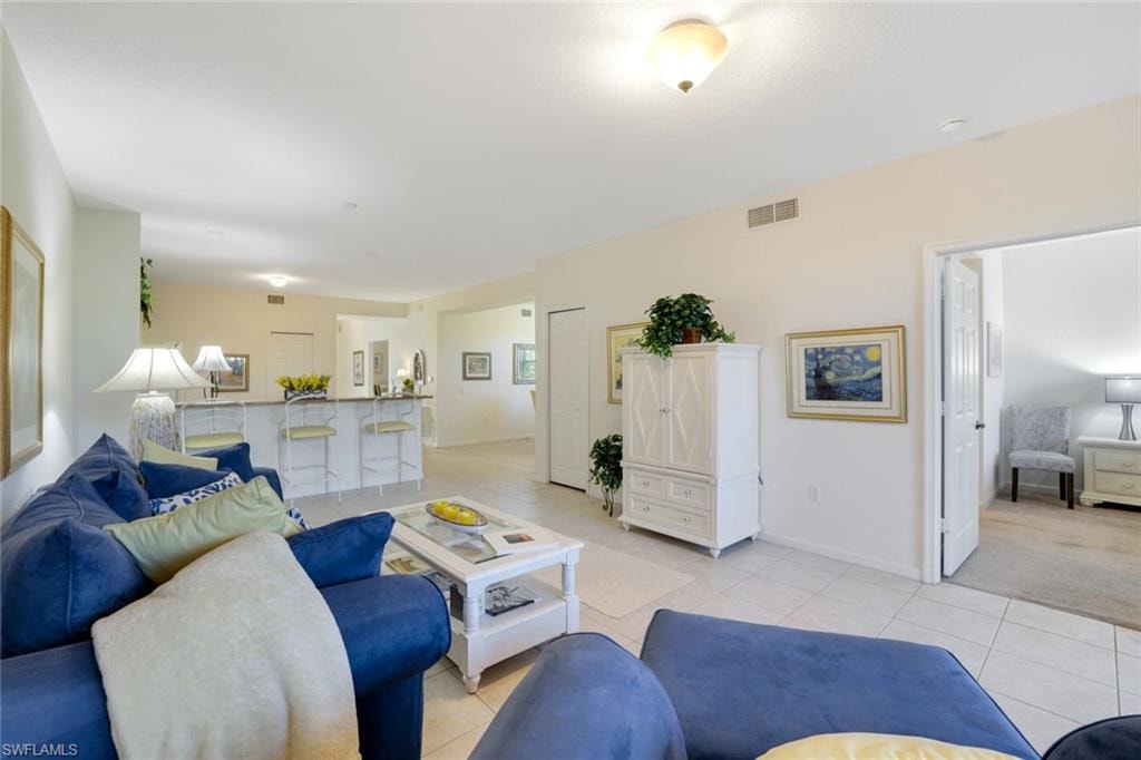 Living area featuring light tile patterned flooring