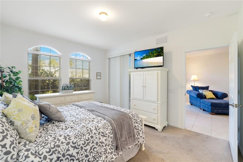 Tiled bedroom with carpet floors and baseboards