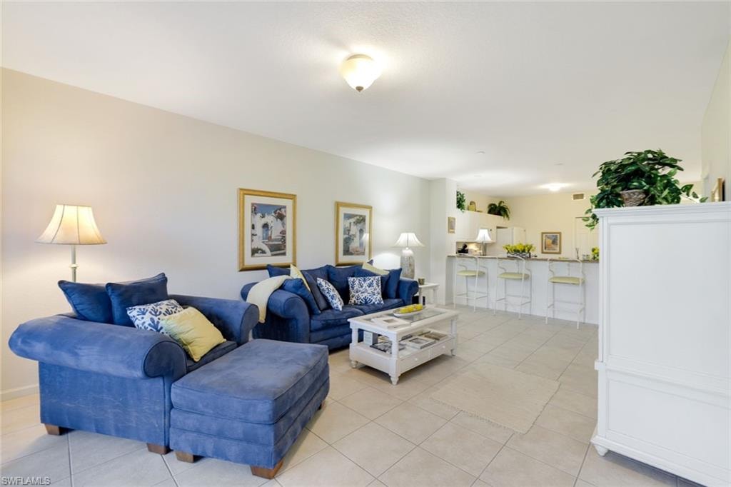Living area featuring light tile patterned flooring