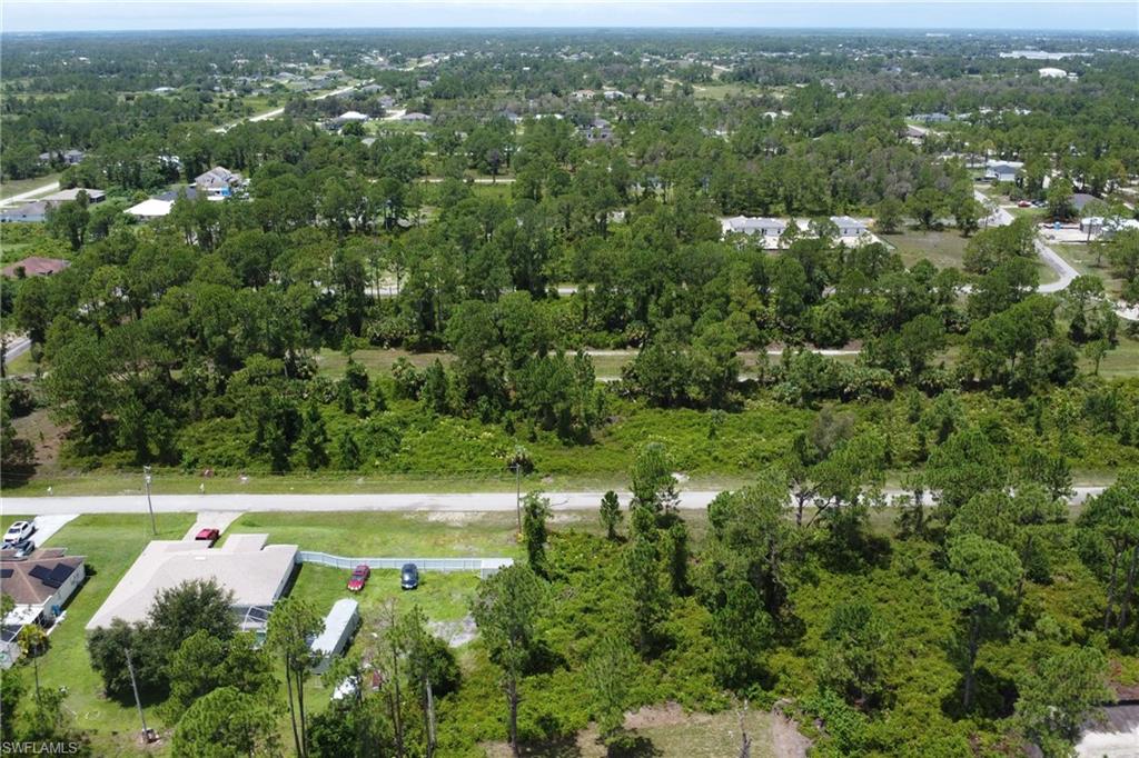 View of property location featuring a heavily wooded area
