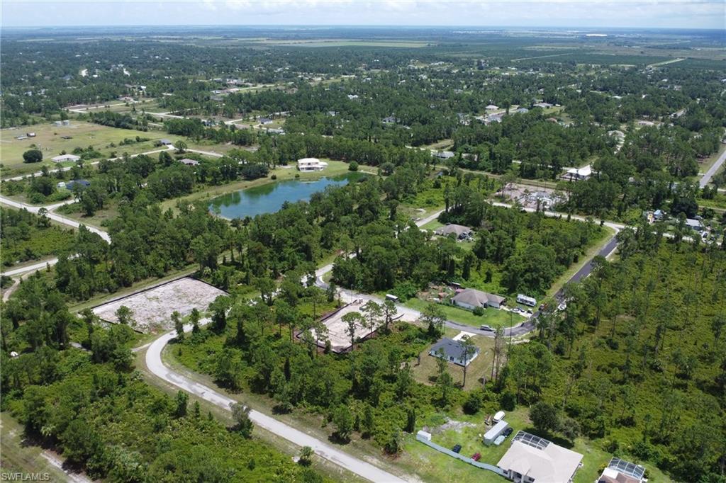 Aerial view of property's location with a nearby body of water