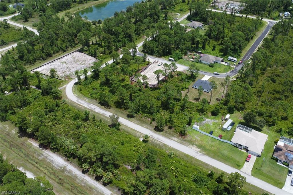 Aerial view of property's location featuring a large body of water