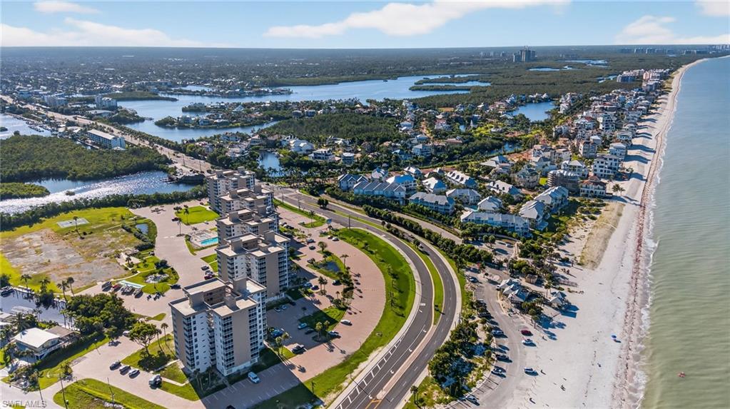Aerial overview of property's location with expansive beach