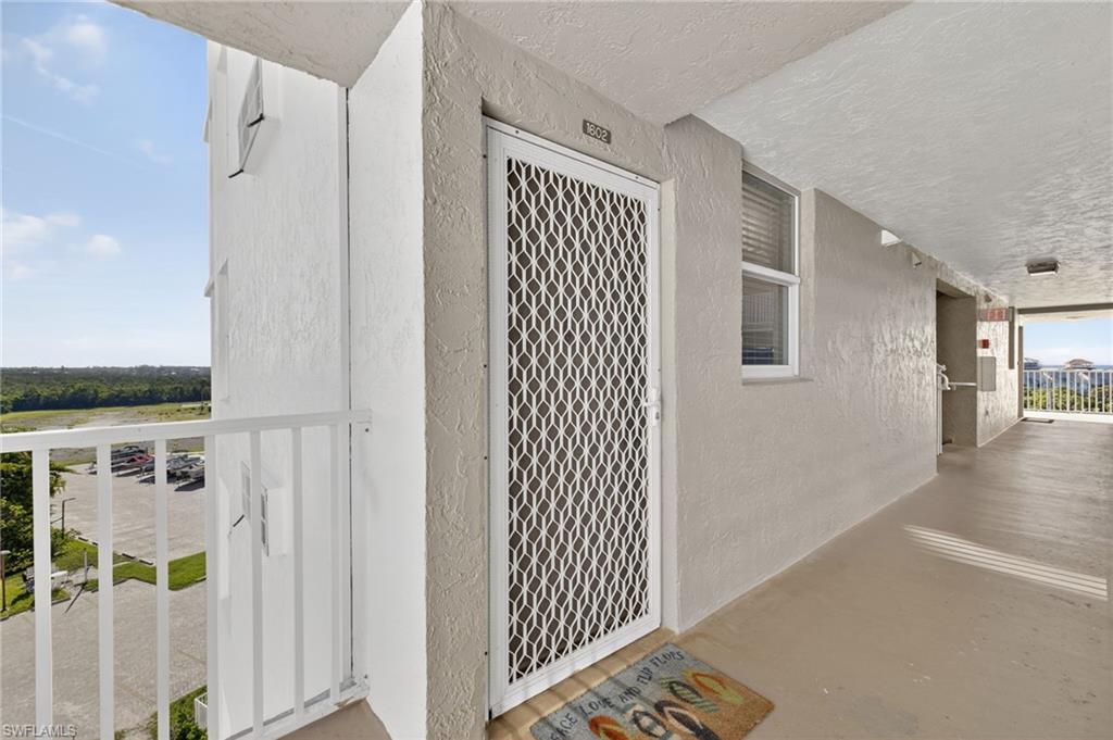 View of exterior entry featuring stucco siding