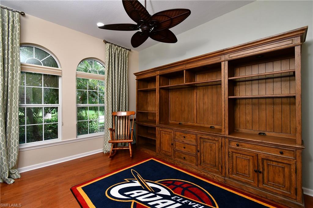 This is the second BR. There is the wall unit/entertainment center that will stay if desired, Still room for a bedroom set