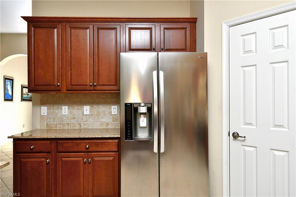Plenty of cabinets and counter space with a walk-in pantry with built in California closet shelving