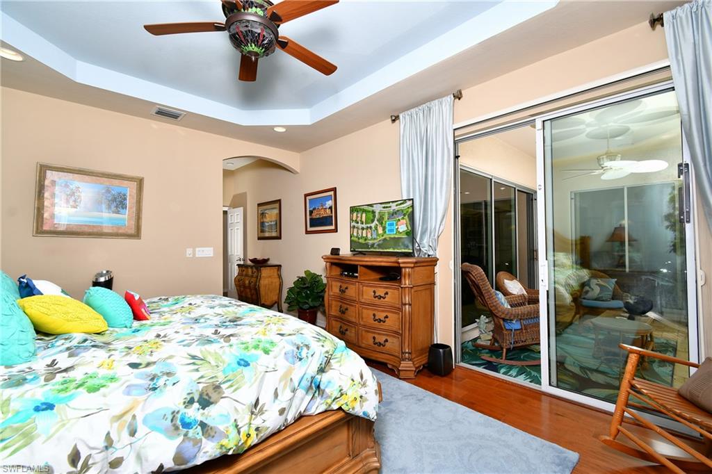 Master BR with slider door opening out onto the lanai/pool area.