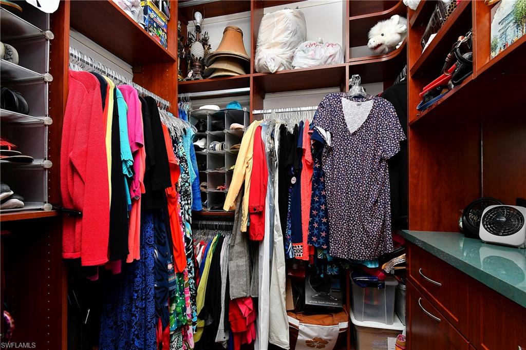 Nice size walk in closet with upgraded California Closet shelves and drawers C