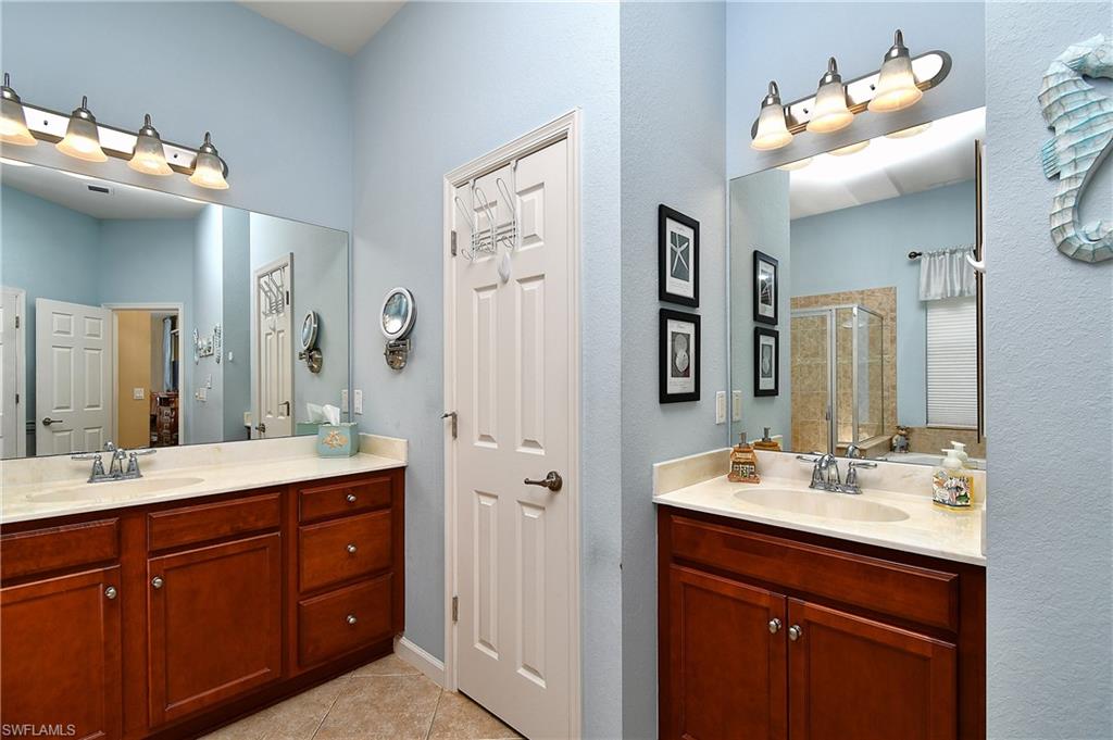 Dual sink vanities and a linen closet