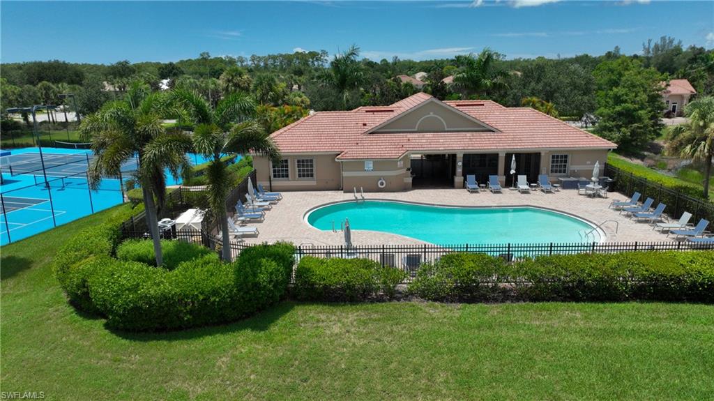 Clubhouse pool with a hot tub and tennis court/pickle ball court