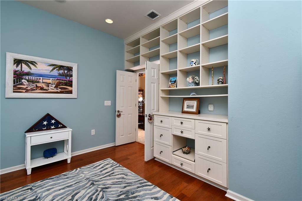 3rd BR with built -in  shelving and drawers on the one wall