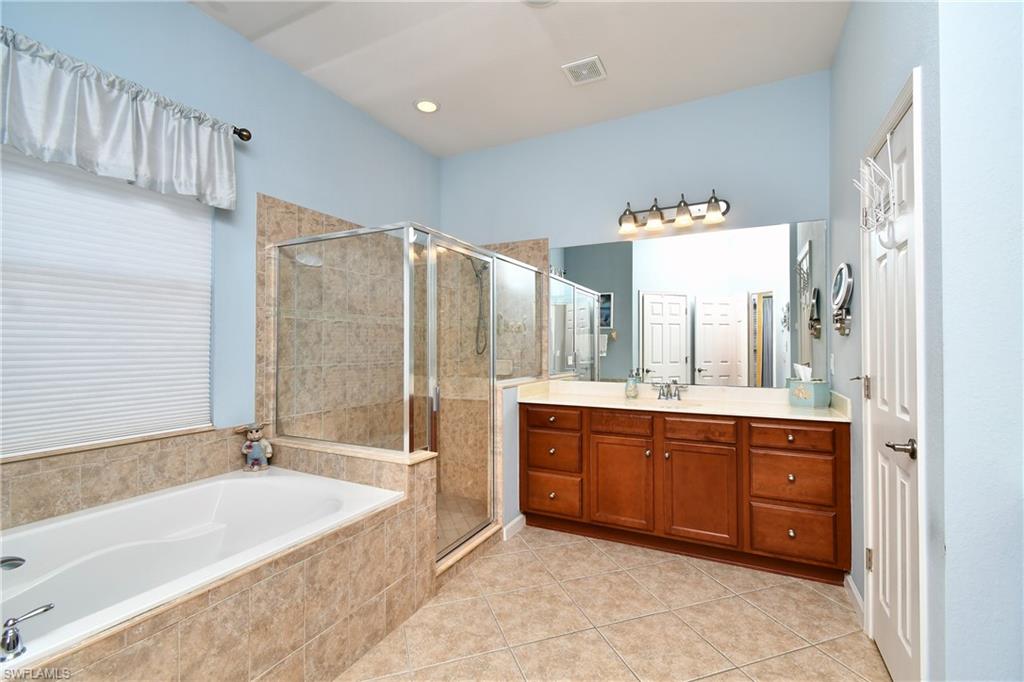 Master Bath with a separate tub and shower area and private lavoratory