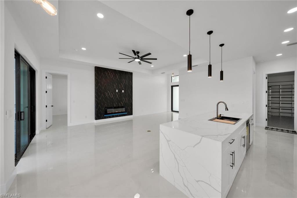 Back of property with a fenced backyard, a patio, stucco siding, and a shingled roof