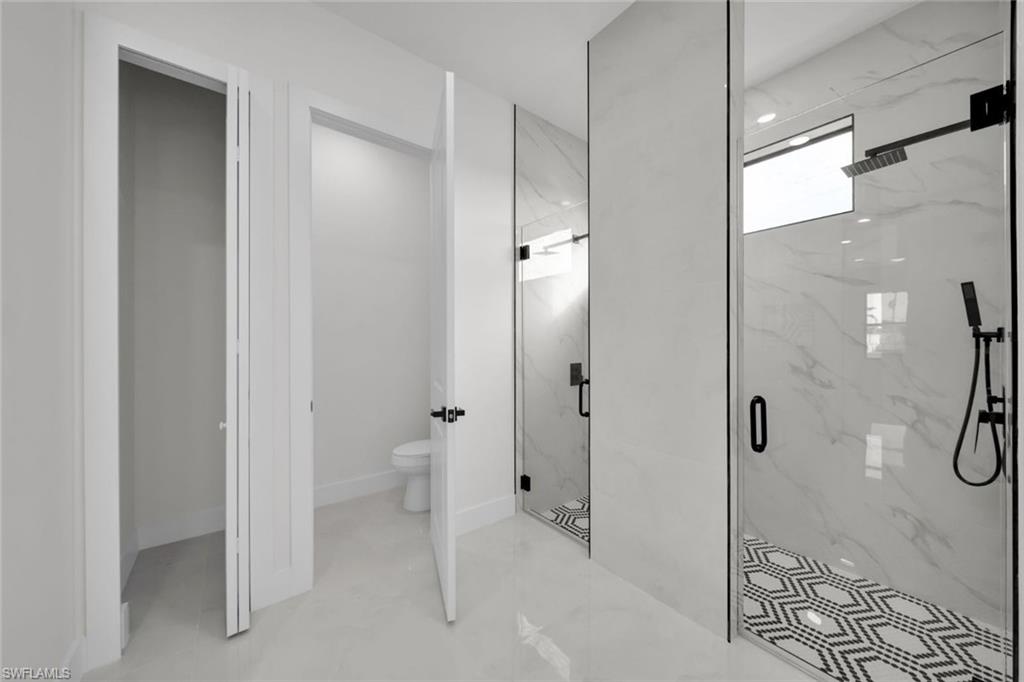 Full bath with vanity and a shower stall