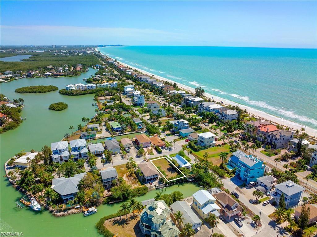 Aerial perspective of suburban area featuring expansive coastline