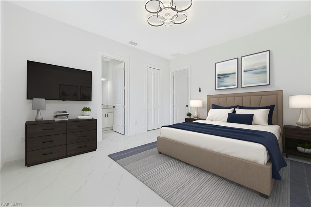 Bedroom featuring light marble finish floors, a chandelier, ensuite bathroom, and a closet