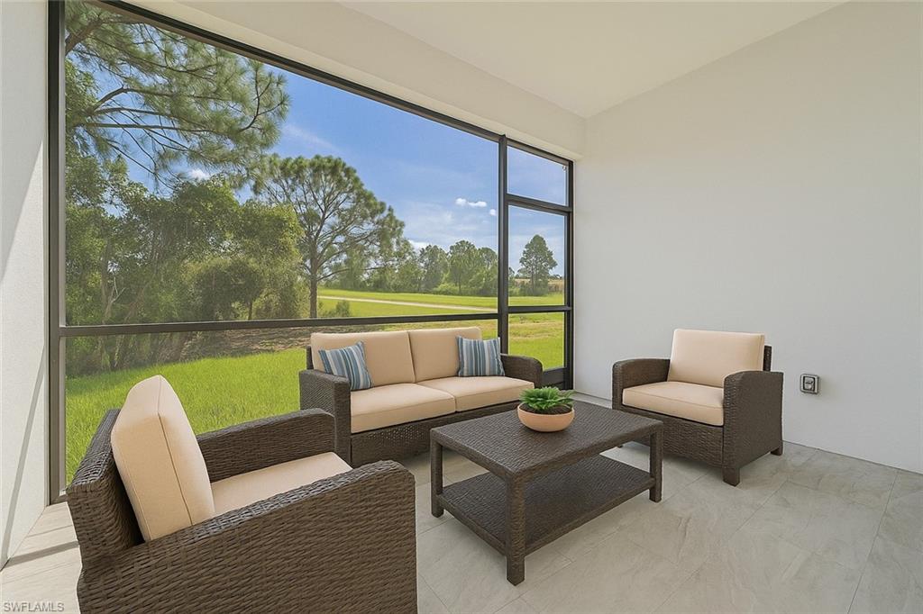 Sunroom featuring golf course view