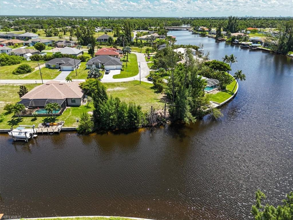 Aerial perspective of suburban area with a large body of water
