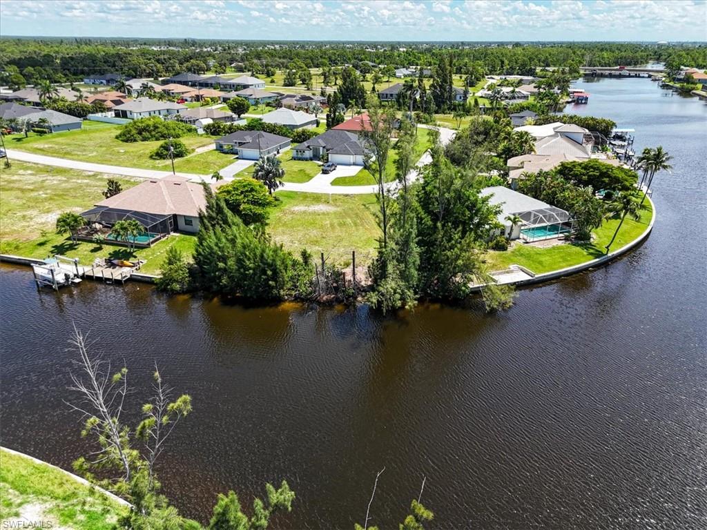 Aerial view of residential area featuring a large body of water