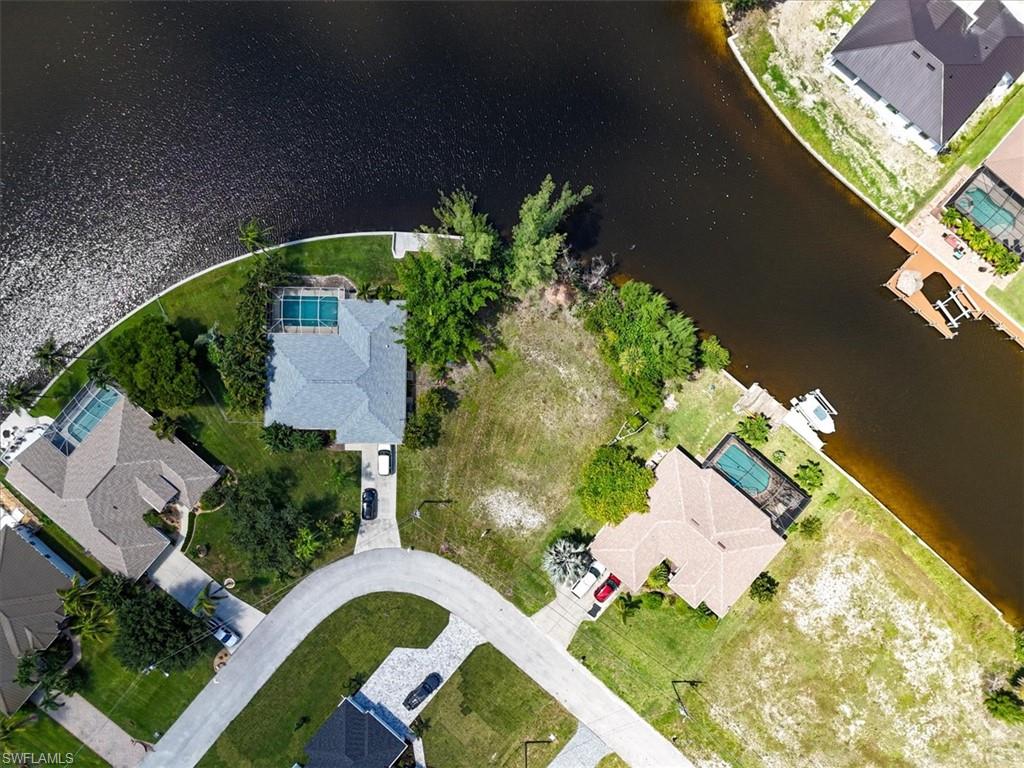 Aerial perspective of suburban area with a large body of water