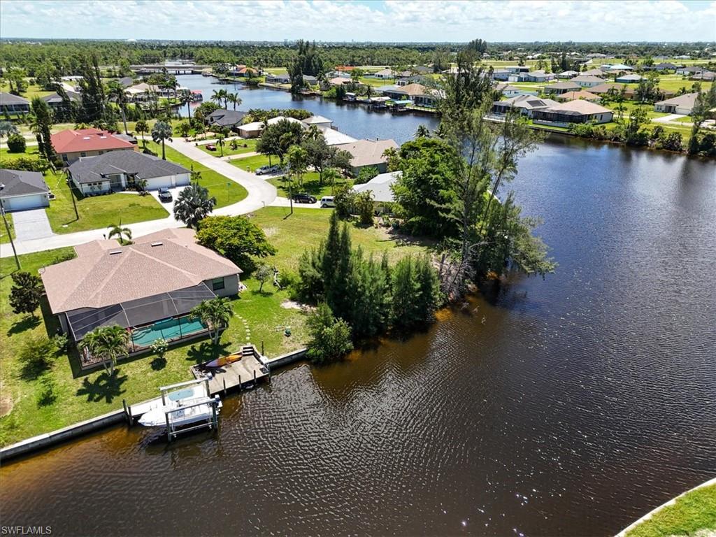 Aerial perspective of suburban area with a large body of water