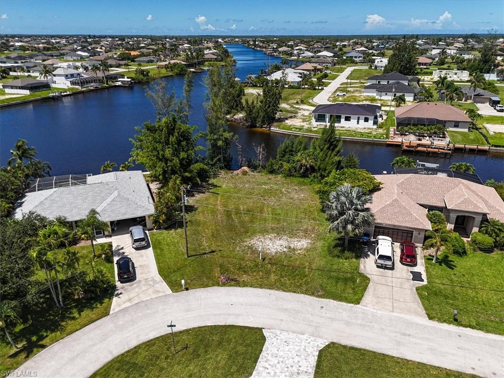 Aerial perspective of suburban area with a large body of water