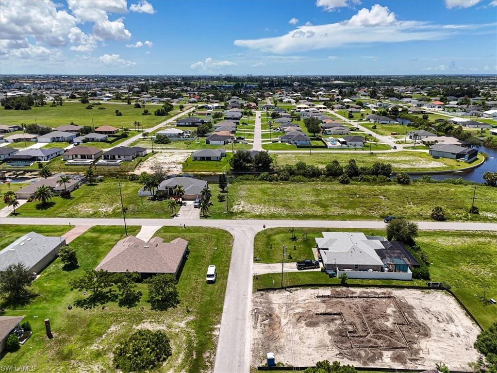 Aerial view of residential area with a large body of water