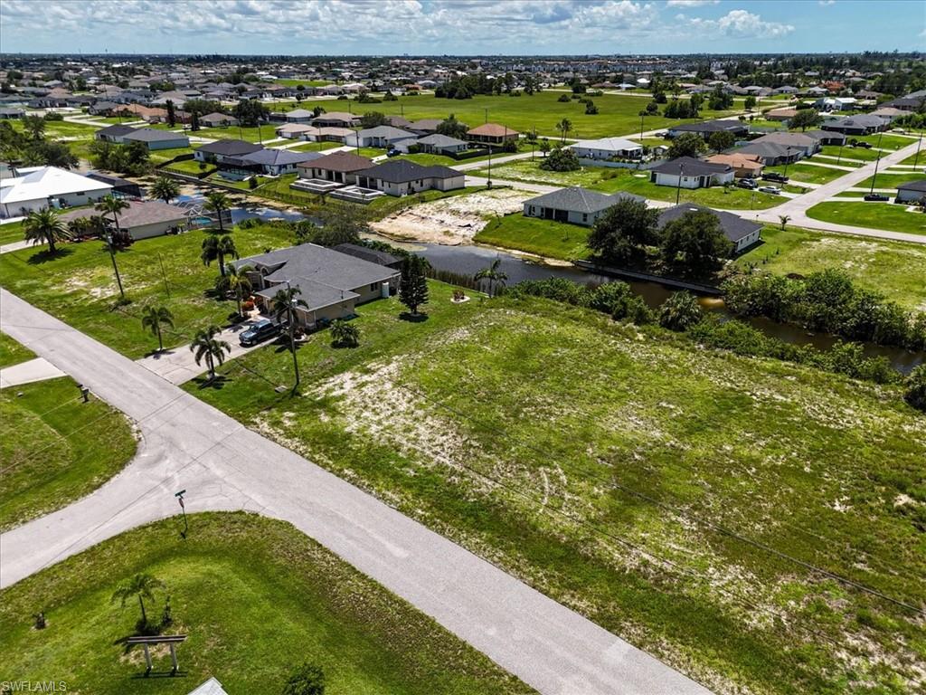 Aerial view of residential area with a nearby body of water