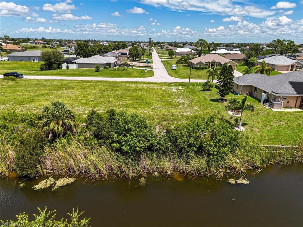 Aerial view of residential area with a large body of water