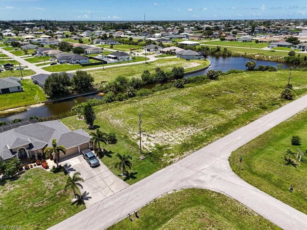 Aerial perspective of suburban area with a large body of water