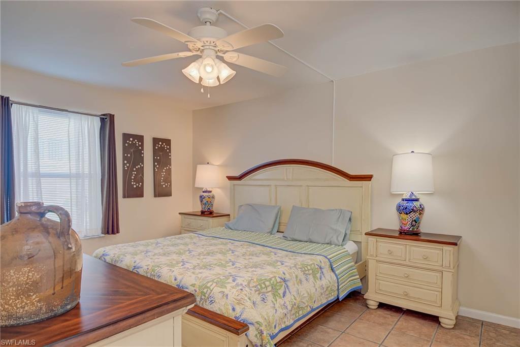 Bedroom featuring a ceiling fan and light tile patterned floors