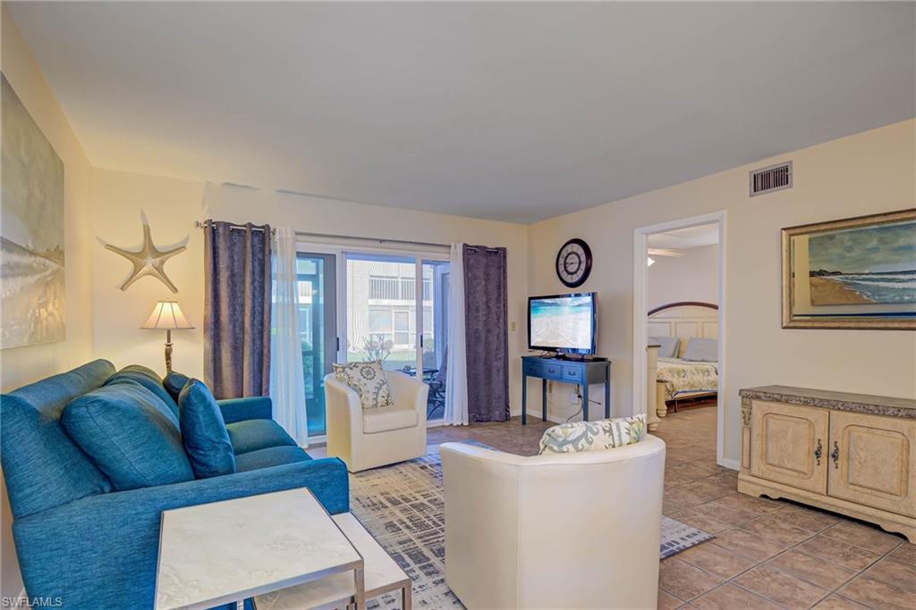 Living room featuring light tile patterned floors