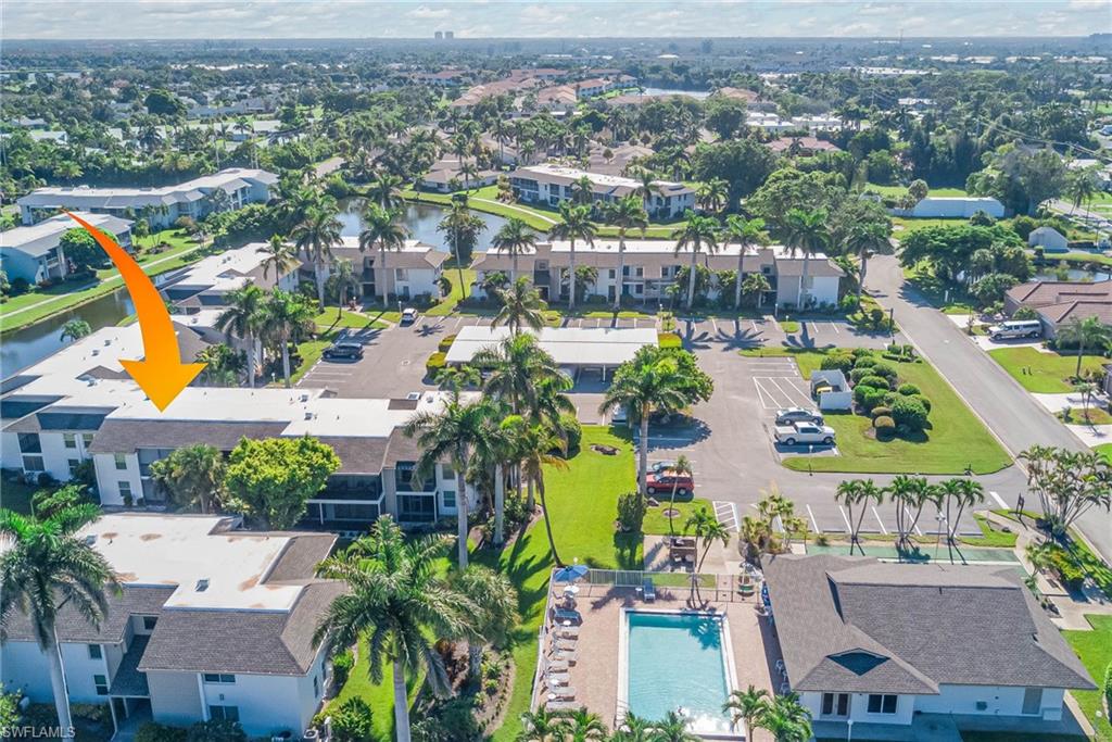 Bird's eye view of a pool and a nearby body of water