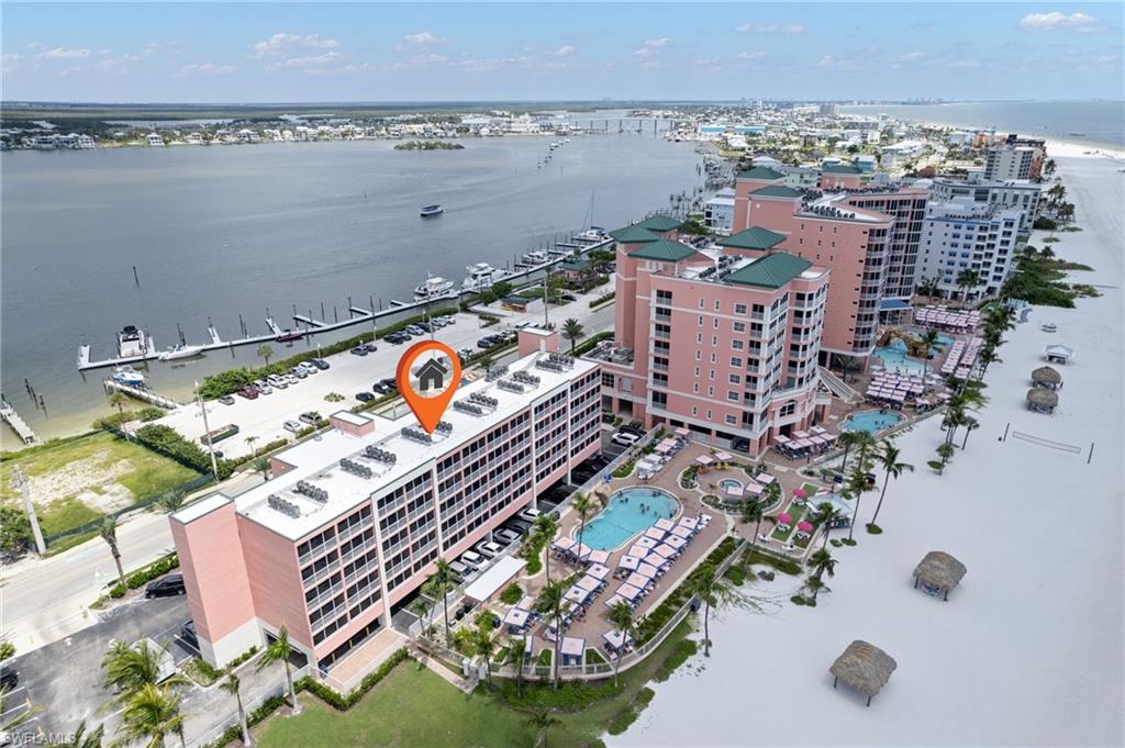 Endless beach with cabanas, bars and pools with the marina just across the street!
