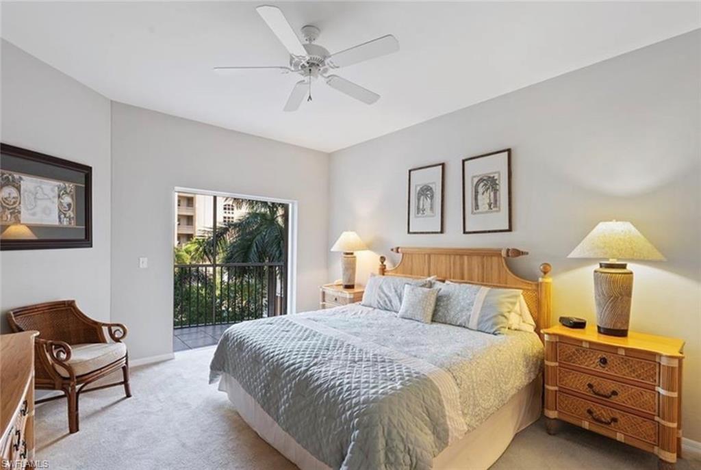 Bedroom featuring ceiling fan, access to exterior, and laminated flooring