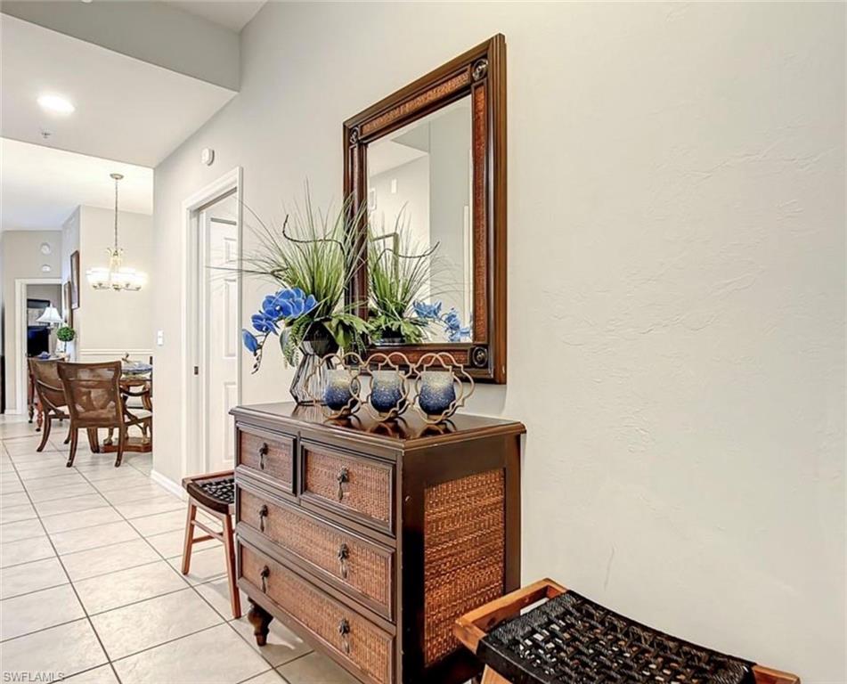 Hall with light tile patterned flooring