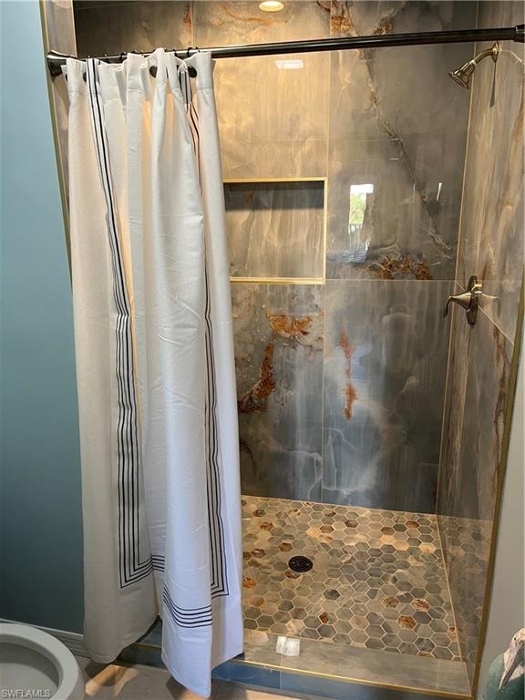 Full bathroom featuring a stall shower