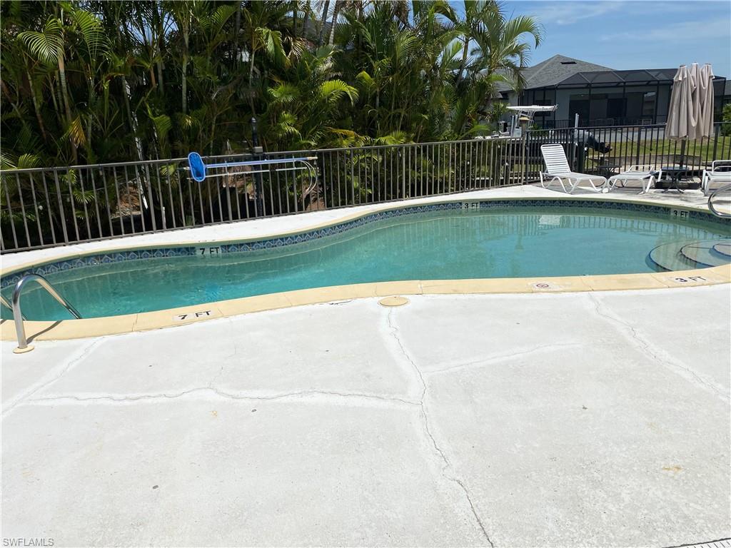 Community pool with a patio area