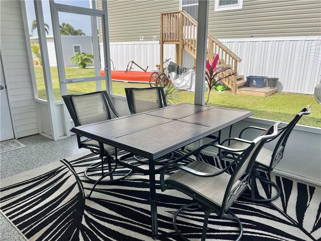 Screened in lanai with epoxy flooring.
