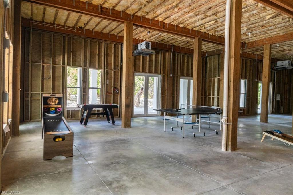 Miscellaneous room featuring plenty of natural light and concrete flooring