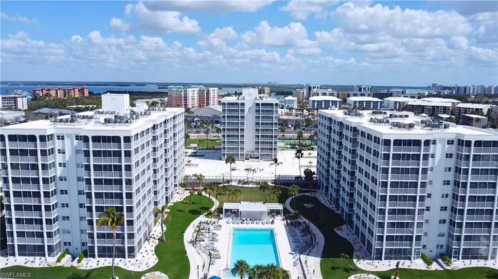 View of urban area with a pool area and apartment complex - Virtually Edited Image