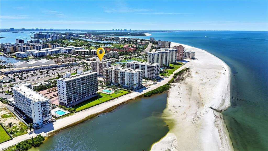 View of condominiums on the Gulf featuring expansive coastline - Virtually Edited Image