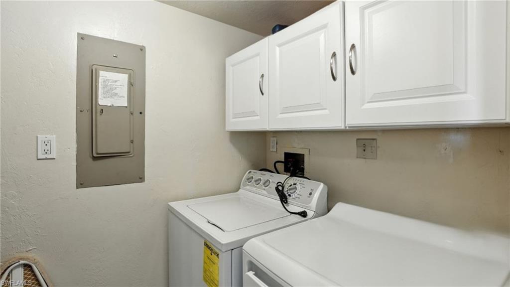 Bathroom featuring vanity, bath / shower combo with glass door, and a closet - Virtually Edited Image