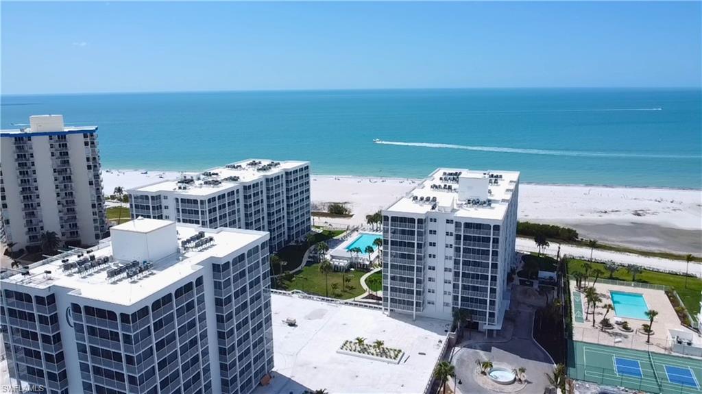 Drone / aerial view of condominium building - Virtually Edited Image